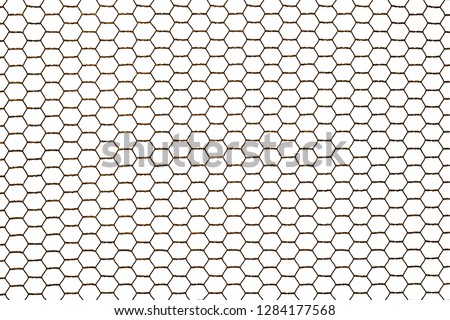 Old rusty steel chicken wire netting isolated on a white background.