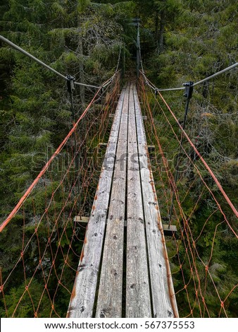 Old and rusty suspensionbridge