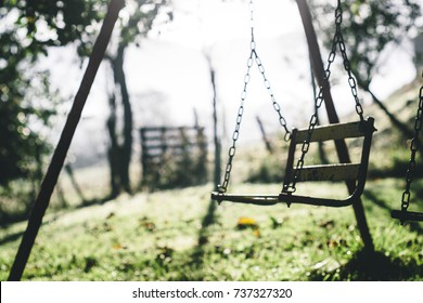 Old Rusty Swing On A Green Park, Childhood Memories