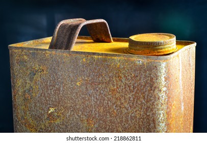 Old Rusty Tin Gallon Gas Can With Cap On Black Background
