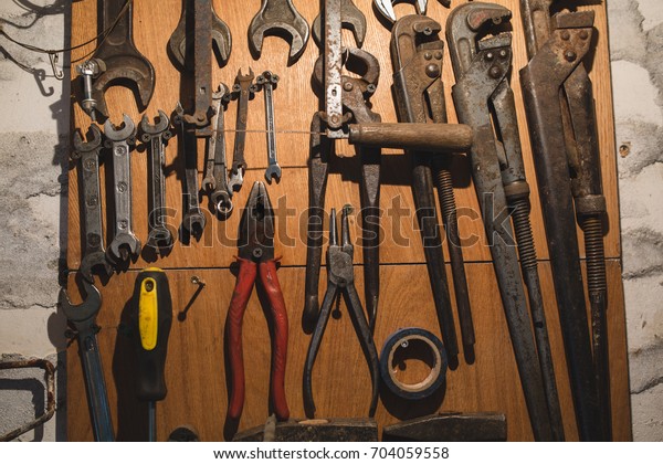 Old Rusty Tools Hang On Wall Stock Photo Edit Now 704059558