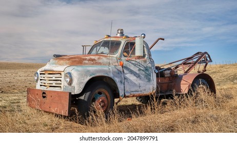 old rusty towing truck on a prairie, early spring scenery in Colorado - Powered by Shutterstock