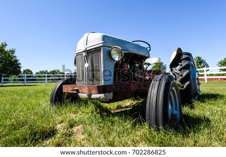 Old Rusty Tractor In A Field