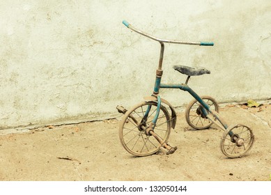 An old and rusty tricycle
