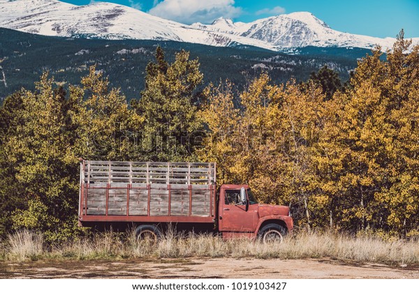 Old\
rusty truck at autumn sunny day in Colorado, USA.\
