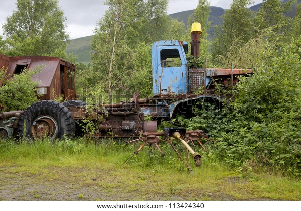 old rusty truck in junk\
yard