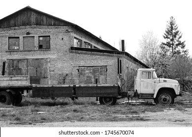 Old Rusty Truck Stands On A Derelict Site