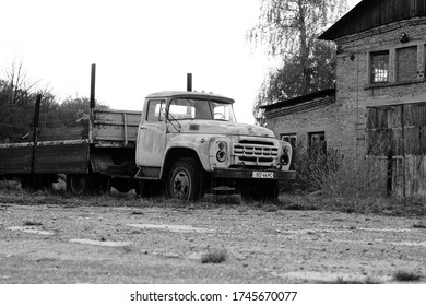 Old Rusty Truck Stands On A Derelict Site