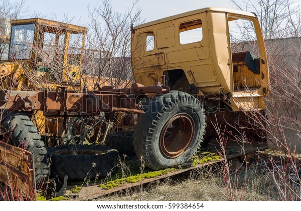Old rusty truck thrown in desert of car park in
ghost town of Pripyat, Chernobyl, Ukraine. Old rusty ancient car,
Broken abandoned ancient rusty iron car. Radiation Zone, Stalker,
Apocalypse Park USSR