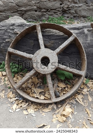 Old rusty wagon wheel in abandoned mine