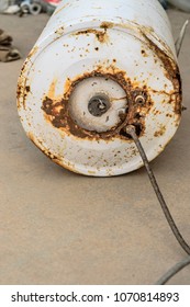 An Old And Rusty Water Heater Was Kept On The Roof Top