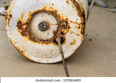 An Old And Rusty Water Heater Was Kept On The Roof Top