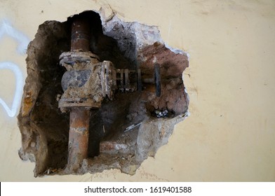 Old Rusty Water Pipe In The Wall 