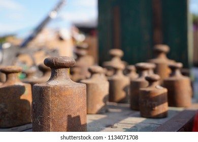 Old rusty weights of different sizes