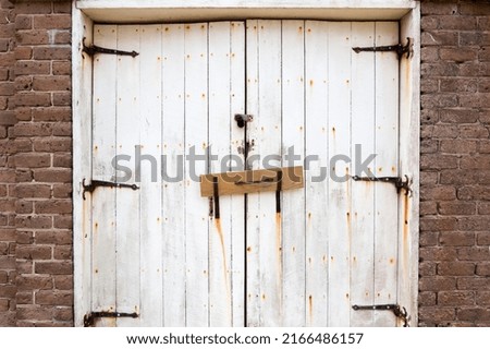 Old and rusty white barn doors from Fort Clinch