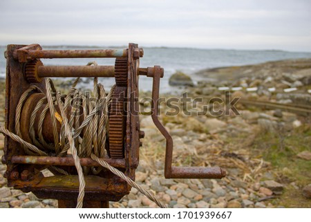 old rusty winch for pulling boats out of the sea