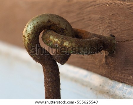Old rusty window stopper