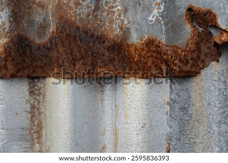 Old rusty zinc wall panel with rusty texture as background. Antique retro interior design concept. Rusty zinc sheet. A place to add text and designs. Photo of rotten zinc. Rusty iron sheet
