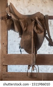 Old Saddle On A Fence