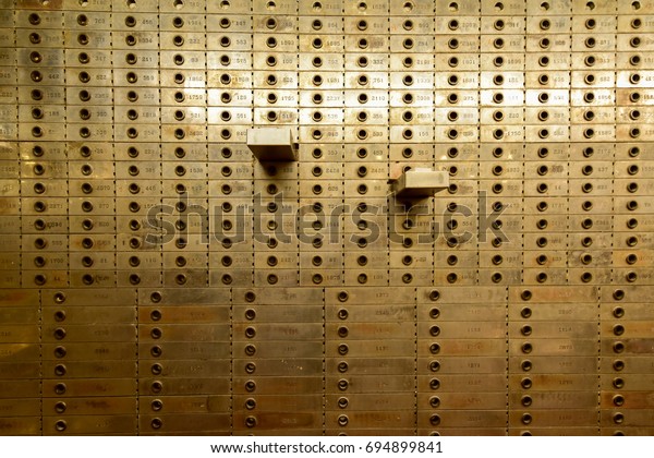 Old Safe Deposit Boxes\
with two open.