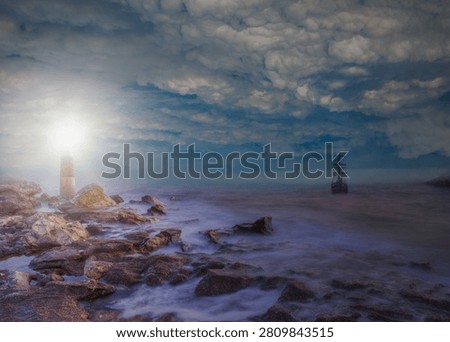 An old sailing ship in the mist sails towards the rocks with amazing lighthouse - Sailing old ship in a storm sea in the background stormy clouds