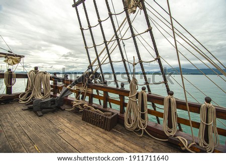 old sailing ship with strings and a mast or wooden ship or principal deck of a sailing ship