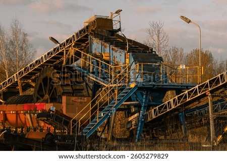 Old sand mining machine in an abandoned place. Heavy and large machine. Old place of former workplace. Searching and exploring abandoned places