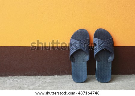 it is old sandal on cement floor and wall.