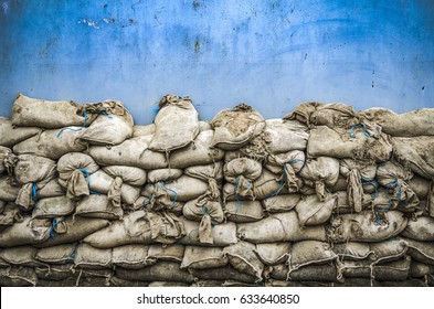 Old sandbag wall for flooding defense or fortification,