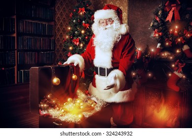 Old Santa Claus with Christmas gifts at home. Christmas decoration.  - Shutterstock ID 324243932