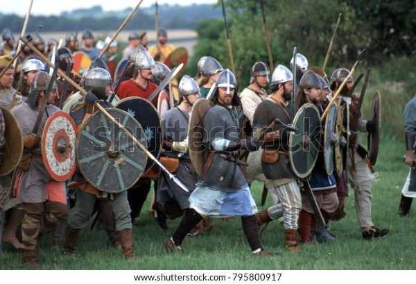 Old Sarum Wiltshire England reenactors of the Anglo\
Saxon and Viking period wear helmets, chain mail armour and carry\
weapons of the period.\
This image was taken at Old Sarum Wiltshire\
England 2002. 