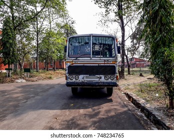 Old School Bus Parked Aside A Road.