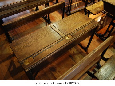 Old school desks inside of classroom
