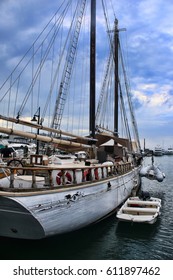 An old schooner moored in the docks of a harbor in Key West