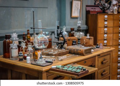 Old Science Lab With Chemical Reagents And Burner