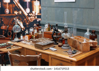 Old Science Lab With Chemical Reagents And Burner