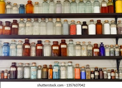 Old Science Laboratory Shelves With Chemical Bottles And Colorful Reagents.