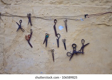Old scissors on a wall