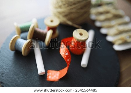 Old scissors, spools of colored thread, centimeter and tailors chalk, flat lay, concept of sewing