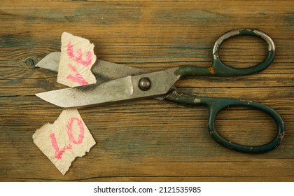 Old scissors with word love. Concept of divorce. Top view