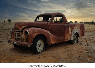 Old Scrap Car found in the outback of Queensland Australia. Old retro rusty abandoned car at sunset. - Powered by Shutterstock