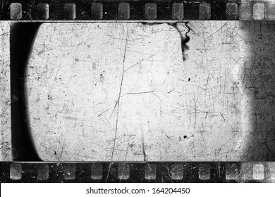 Old scratched and damaged grungy negative filmstrip