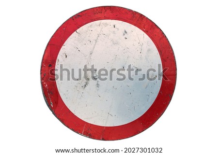 Old scratched round red road sign 'No entry' isolated on white.