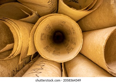 Old scribe library. Retro futhpak scrolls stacked on a pile. View from inside.
