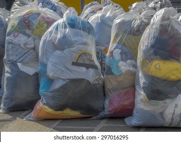 Old Second-hand Clothes In Plastic Bags