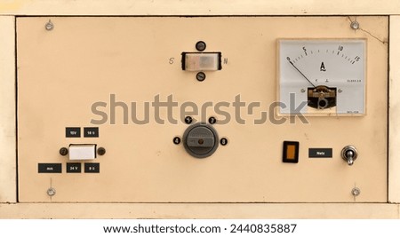 old self made vintage electrical device with measuring scale and switches in a beige wooden case