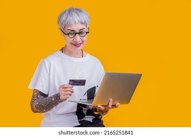 Old Senior Asian Woman Tattoo Hand Show Credit Card Laptop With Smile Confident And Cheerful Studio Shot,asia Old Woman Grey Hair Standing Hand Gesture Hold Credit Care Cashless Payment Business Ideas