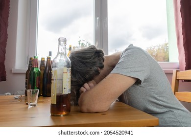 Old Senior Female Woman Sit Next To Table Drink Alcohol Bottle At Home Sad Alone Alcoholism Signs And Symptoms Rehab Abuse And Recovery Problems