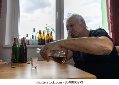 Old Senior Male Man Sit Next To Table Drink Alcohol Bottle At Home Sad Alone Alcoholism Signs And Symptoms Rehab Abuse And Recovery Problems