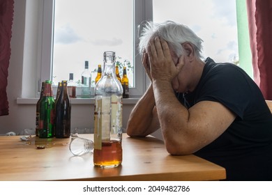 Old Senior Male Man Sit Next To Table Drink Alcohol Bottle At Home Sad Alone Alcoholism Signs And Symptoms Rehab Abuse And Recovery Problems